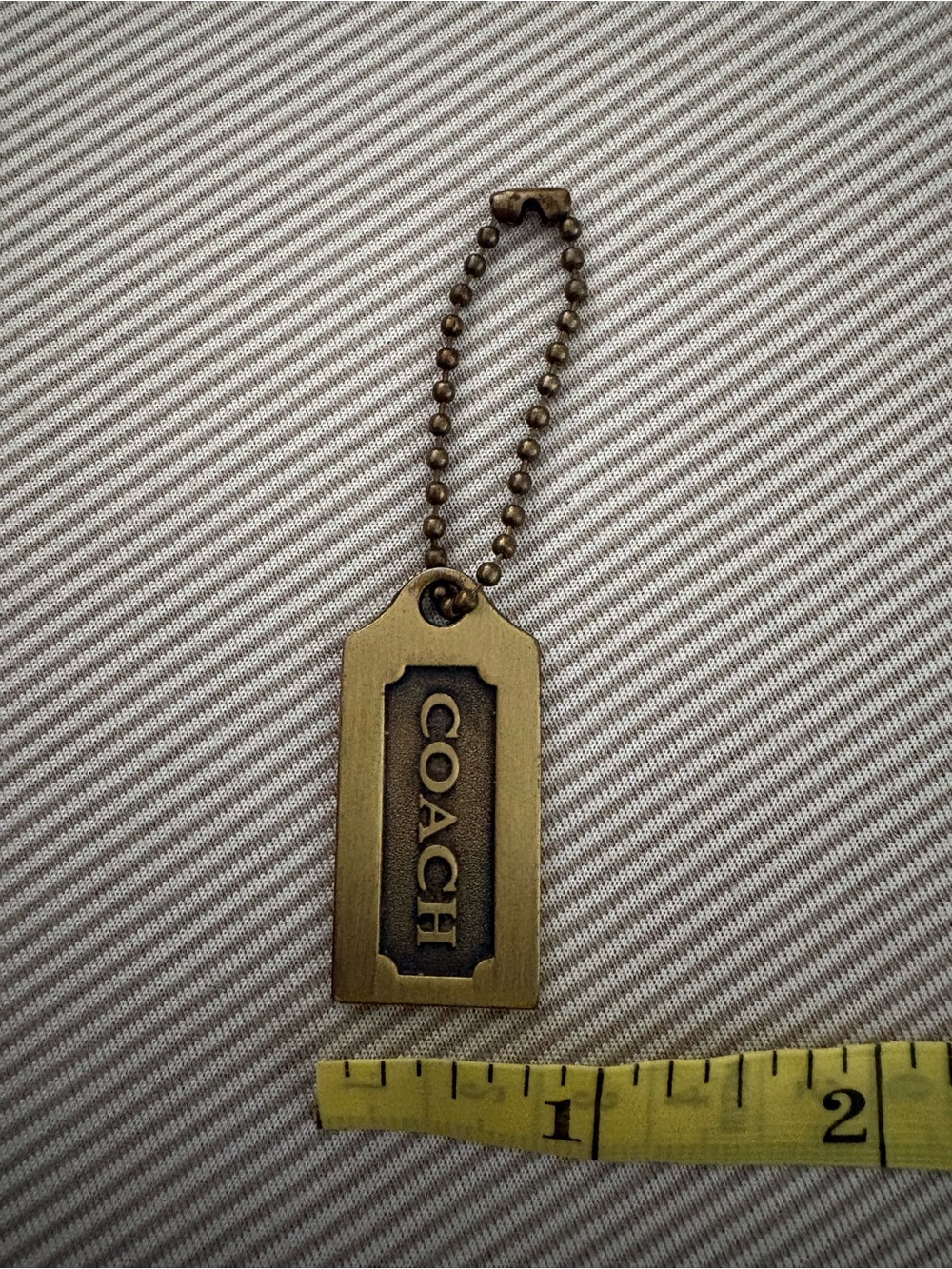 Coach Brass/Antique Gold hangtag - Picture 3 of 3